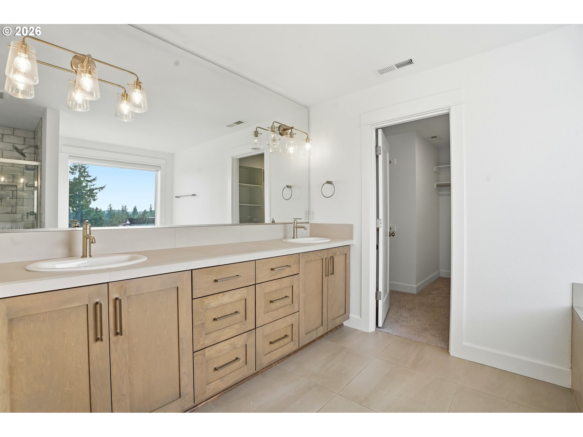 14146 South Cleveland Street Oregon City, OR 97045 - Photo 23 of 46 a spacious bathroom with a granite countertop sink mirror and a