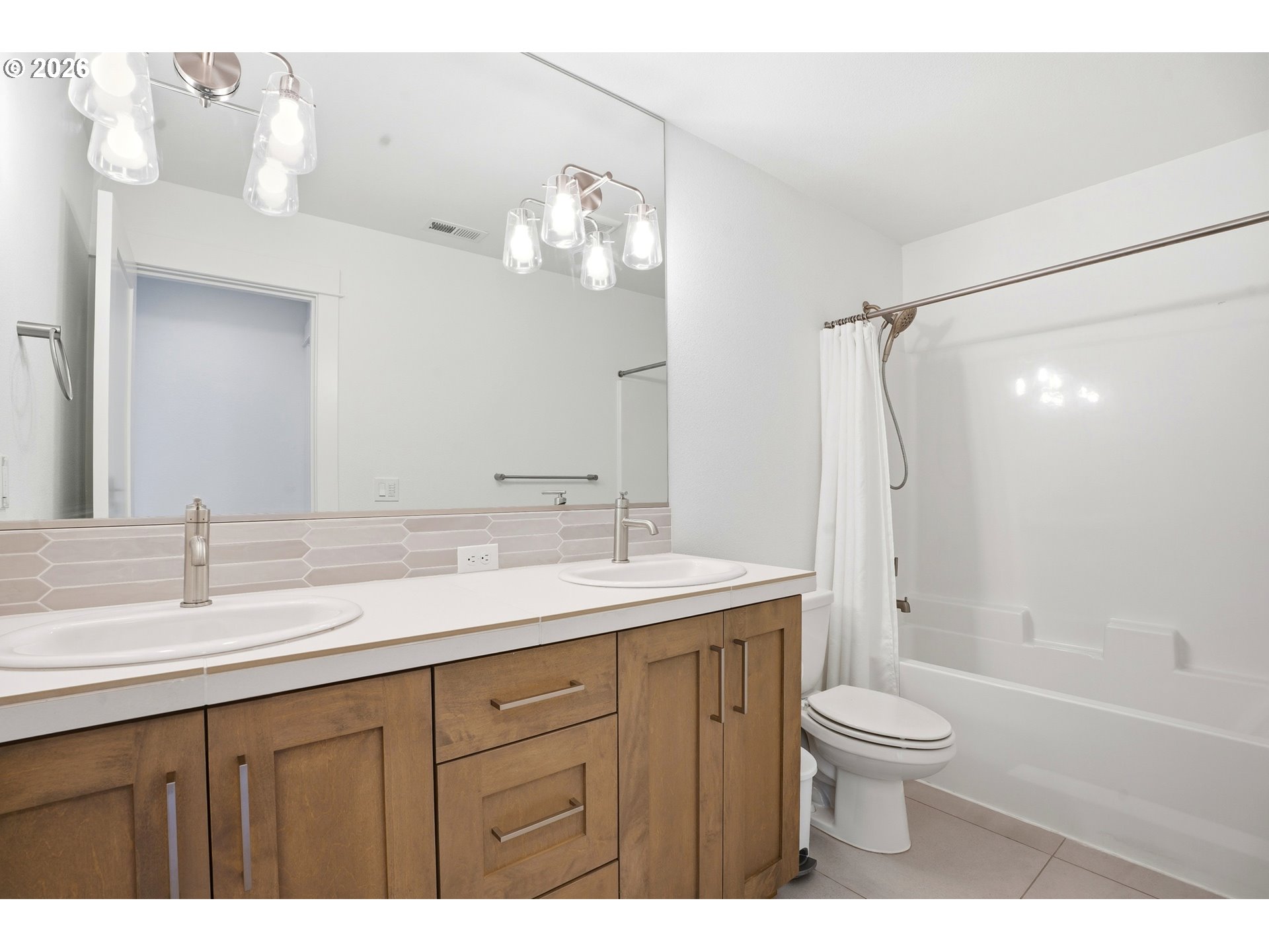 14146 South Cleveland Street Oregon City, OR 97045 - Photo 34 of 46 a bathroom with a sink double vanity granite toilet and shower