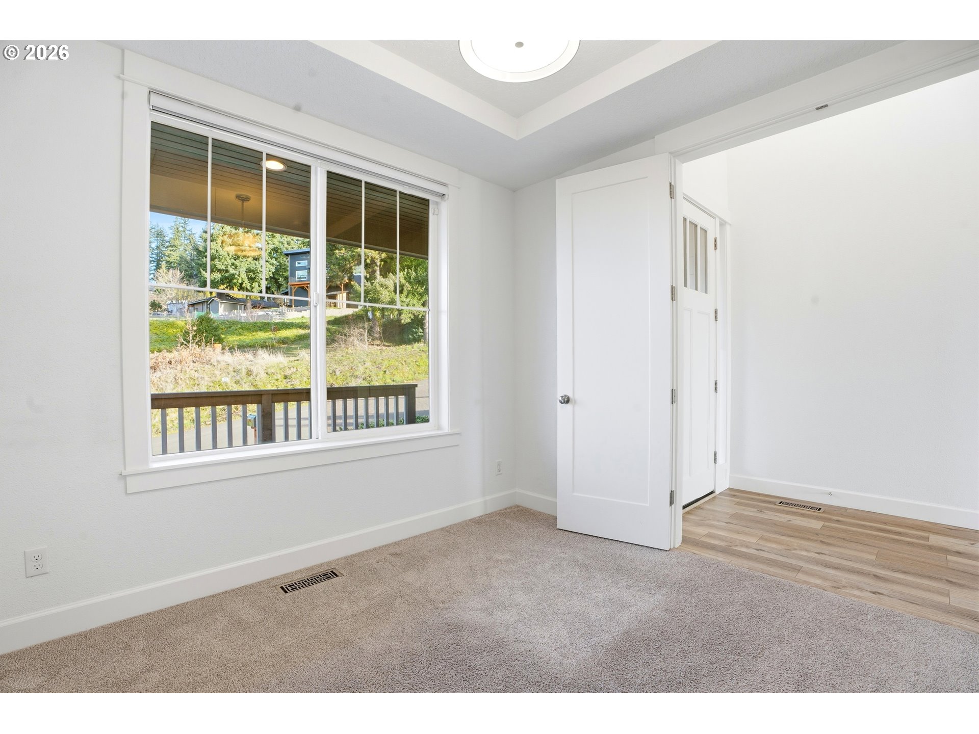 14146 South Cleveland Street Oregon City, OR 97045 - Photo 4 of 46 a view of an empty room with a window
