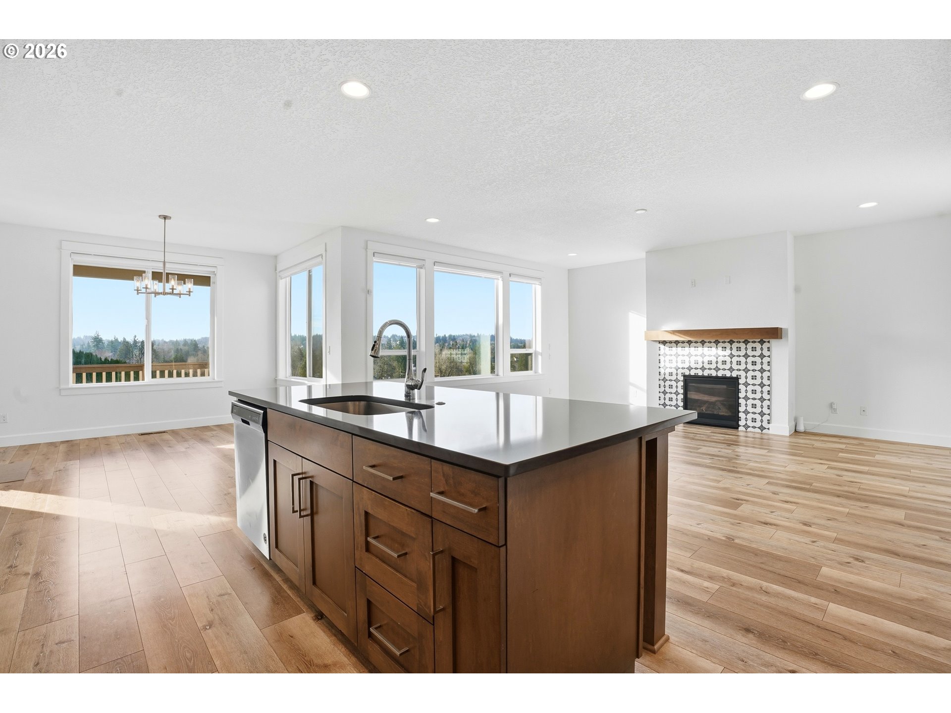 14146 South Cleveland Street Oregon City, OR 97045 - Photo 10 of 46 a kitchen with kitchen island a sink stainless steel appliances and cabinets