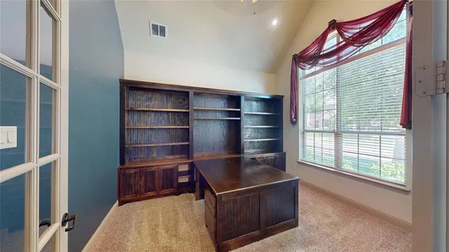 a view of room with window and wooden floor