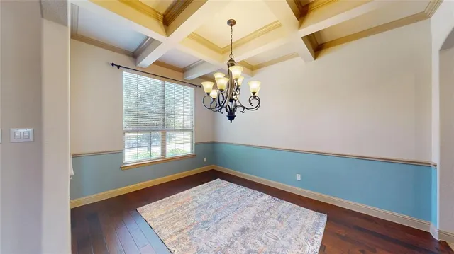 a bathroom with a granite countertop toilet sink and mirror