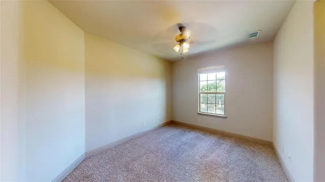 a bathroom with a granite countertop sink toilet a mirror and shower