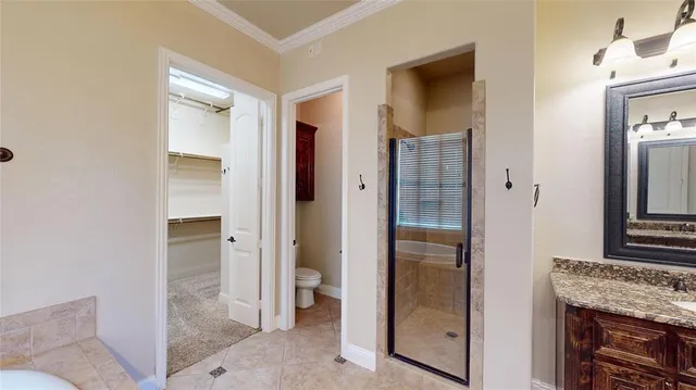 a bathroom with a granite countertop shower mirror and a sink