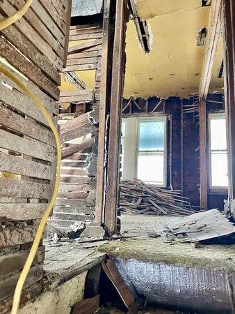a view of a room with wooden walls