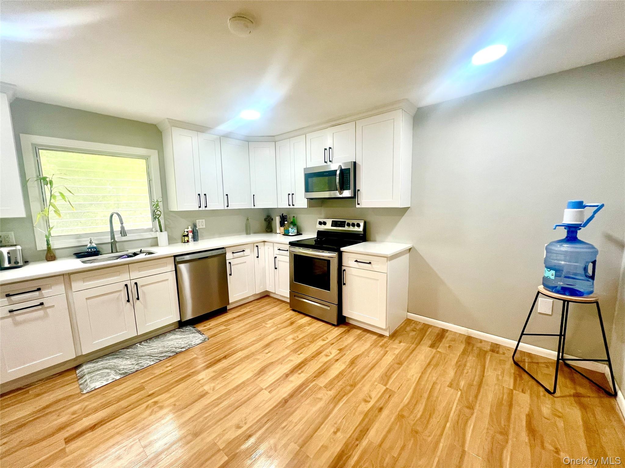 26 Orange Road Florida, NY 10921 - Photo 13 of 39 a kitchen with a sink a counter top space cabinets and appliances