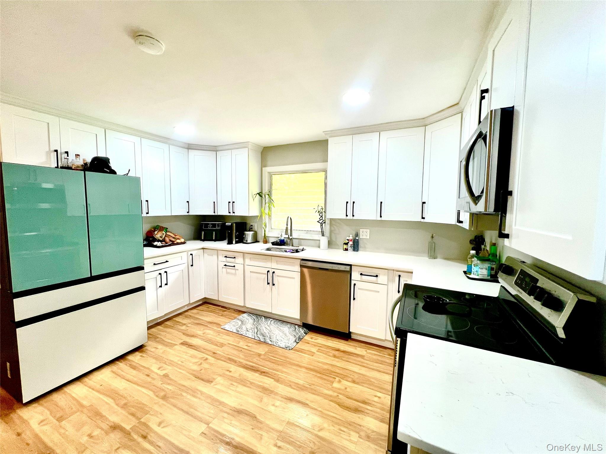 26 Orange Road Florida, NY 10921 - Photo 14 of 39 a white kitchen with sink and cabinets