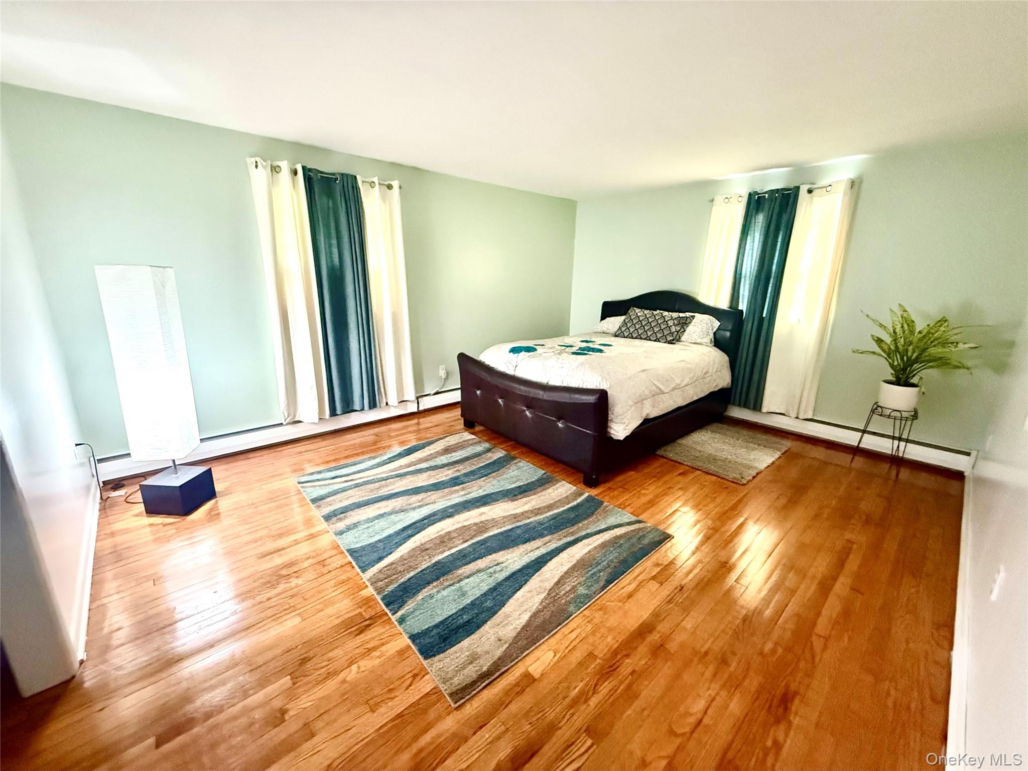 26 Orange Road Florida, NY 10921 - Photo 18 of 39 a spacious bedroom with a bed and a large window