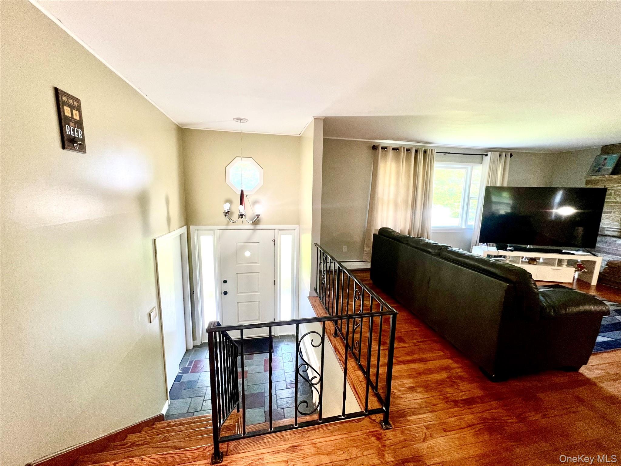 26 Orange Road Florida, NY 10921 - Photo 23 of 39 a living room with furniture and a flat screen tv