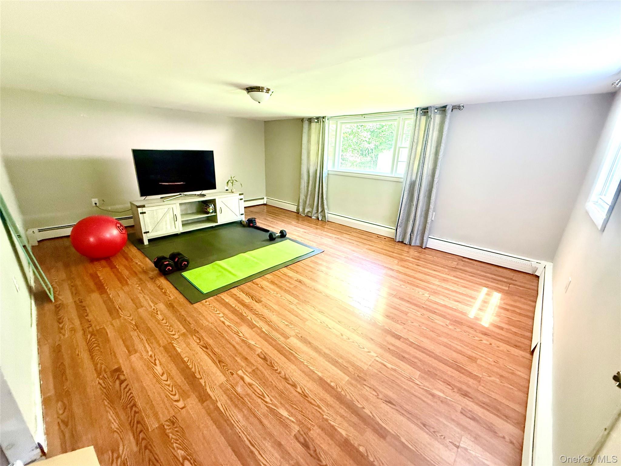 26 Orange Road Florida, NY 10921 - Photo 24 of 39 a room with a bed and a flat screen tv