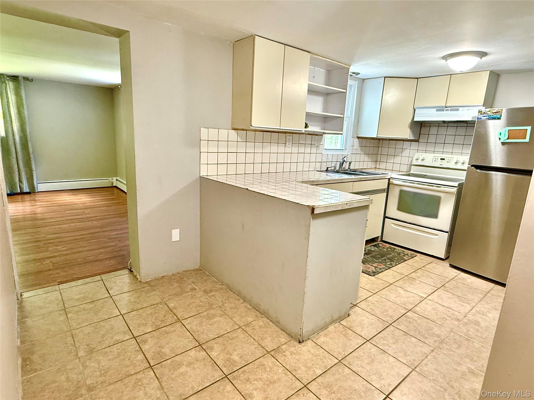 26 Orange Road Florida, NY 10921 - Photo 27 of 39 a kitchen with a sink cabinets and a stove top oven