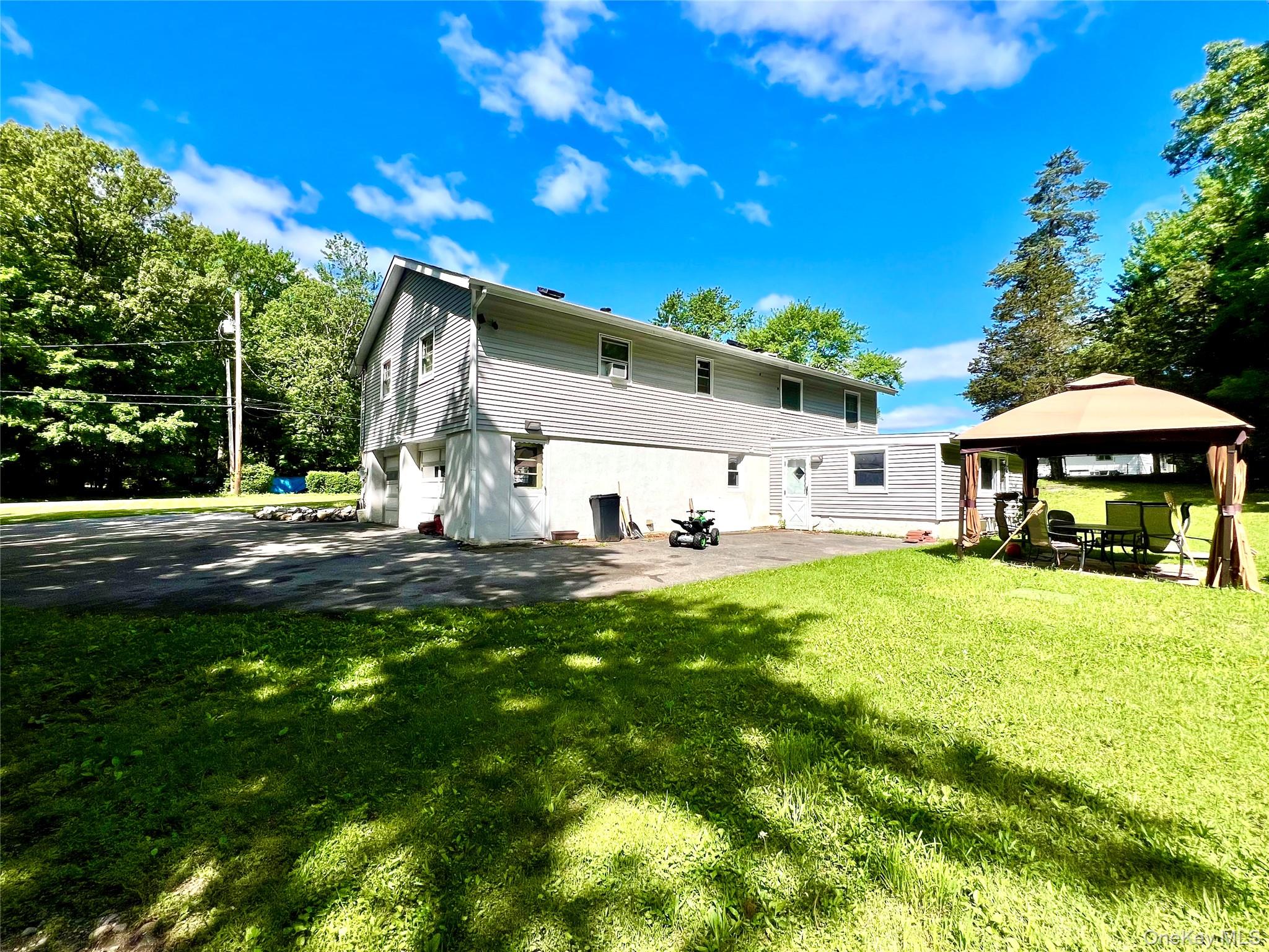 26 Orange Road Florida, NY 10921 - Photo 34 of 39 a view of a house with backyard and sitting area