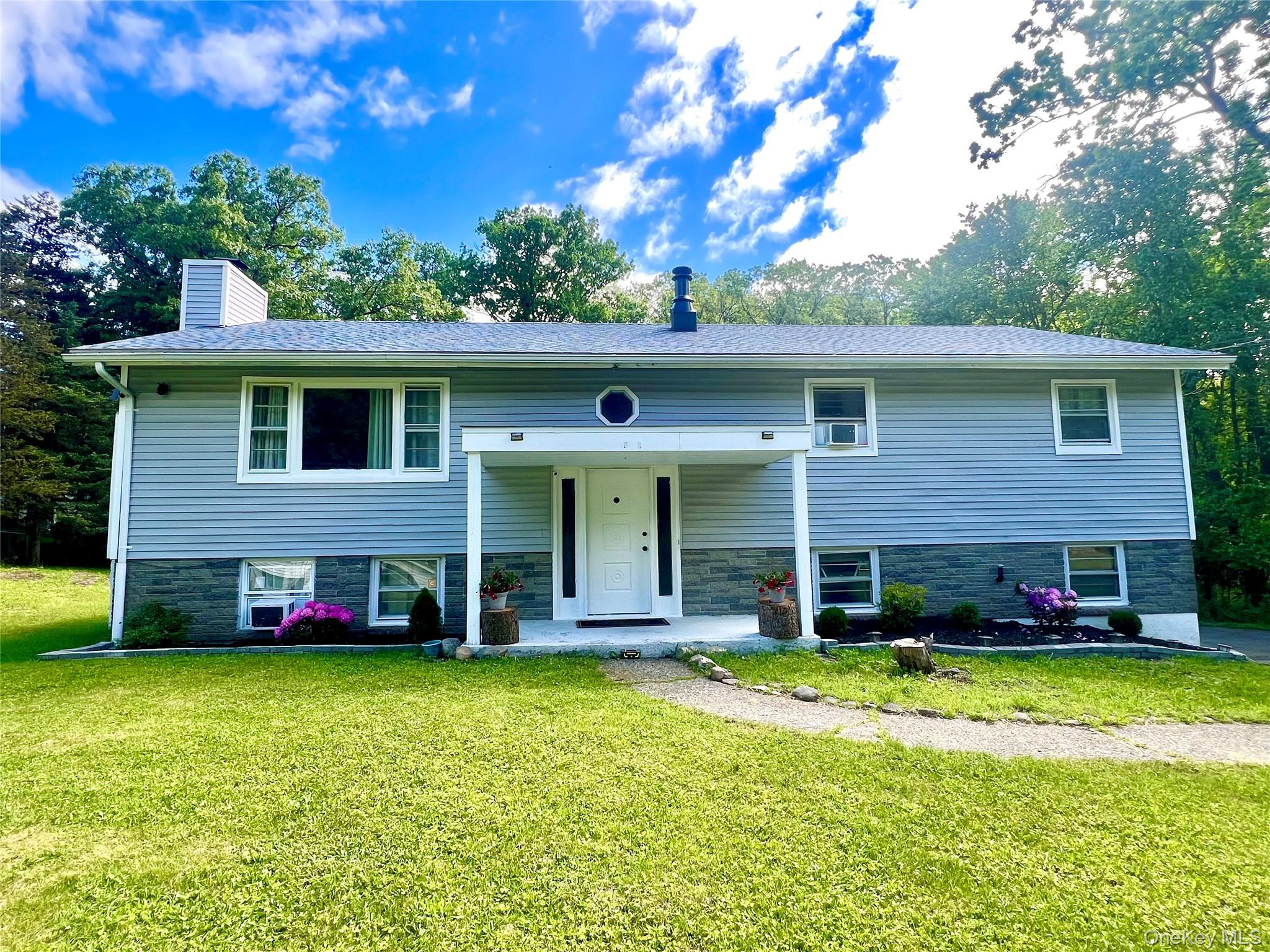 26 Orange Road Florida, NY 10921 - Photo 36 of 39 a view of a house with a yard patio and a garden
