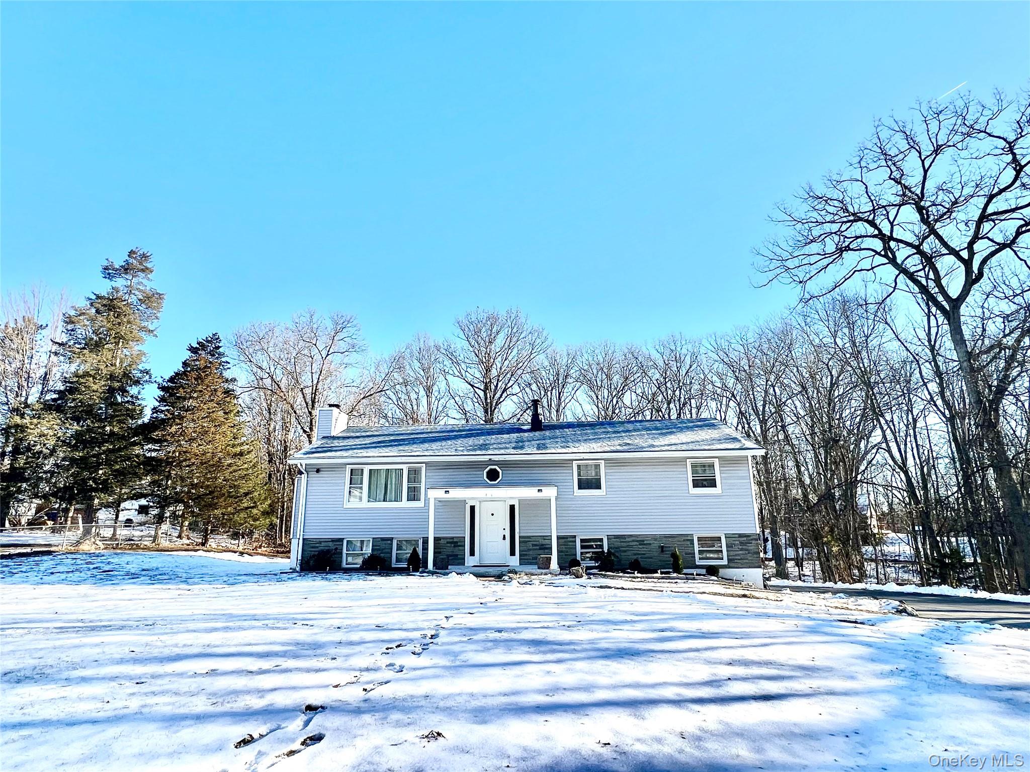 26 Orange Road Florida, NY 10921 - Photo 5 of 39 a front view of a house with a yard
