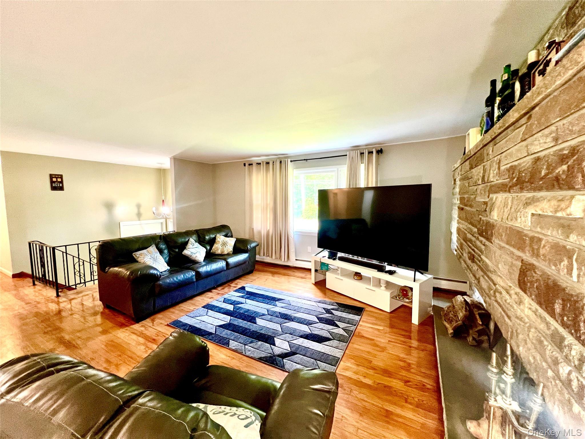 26 Orange Road Florida, NY 10921 - Photo 8 of 39 a living room with furniture and a flat screen tv