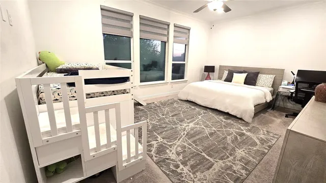 a spacious bedroom with a bed and a closet