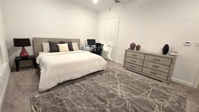 a bed room with a bed and a television