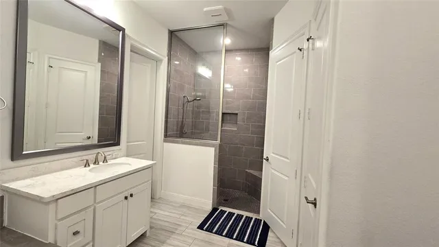 a bathroom with a shower and toilet