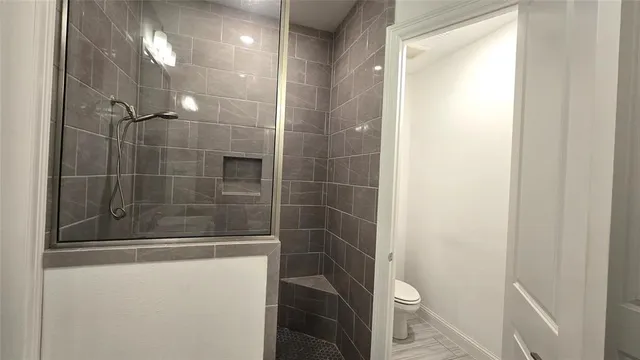 a en suite bathroom with a sink a mirror and a bathtub