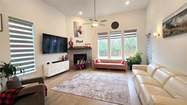 a living room with furniture and a fireplace