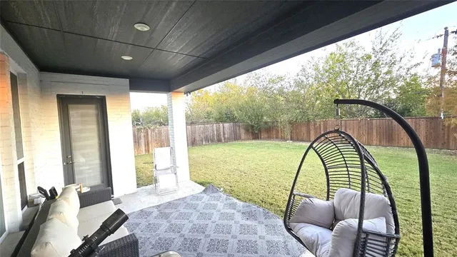 a view of a house with a yard and sitting area