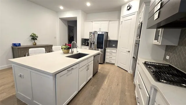 a view of living room with furniture and a potted plant