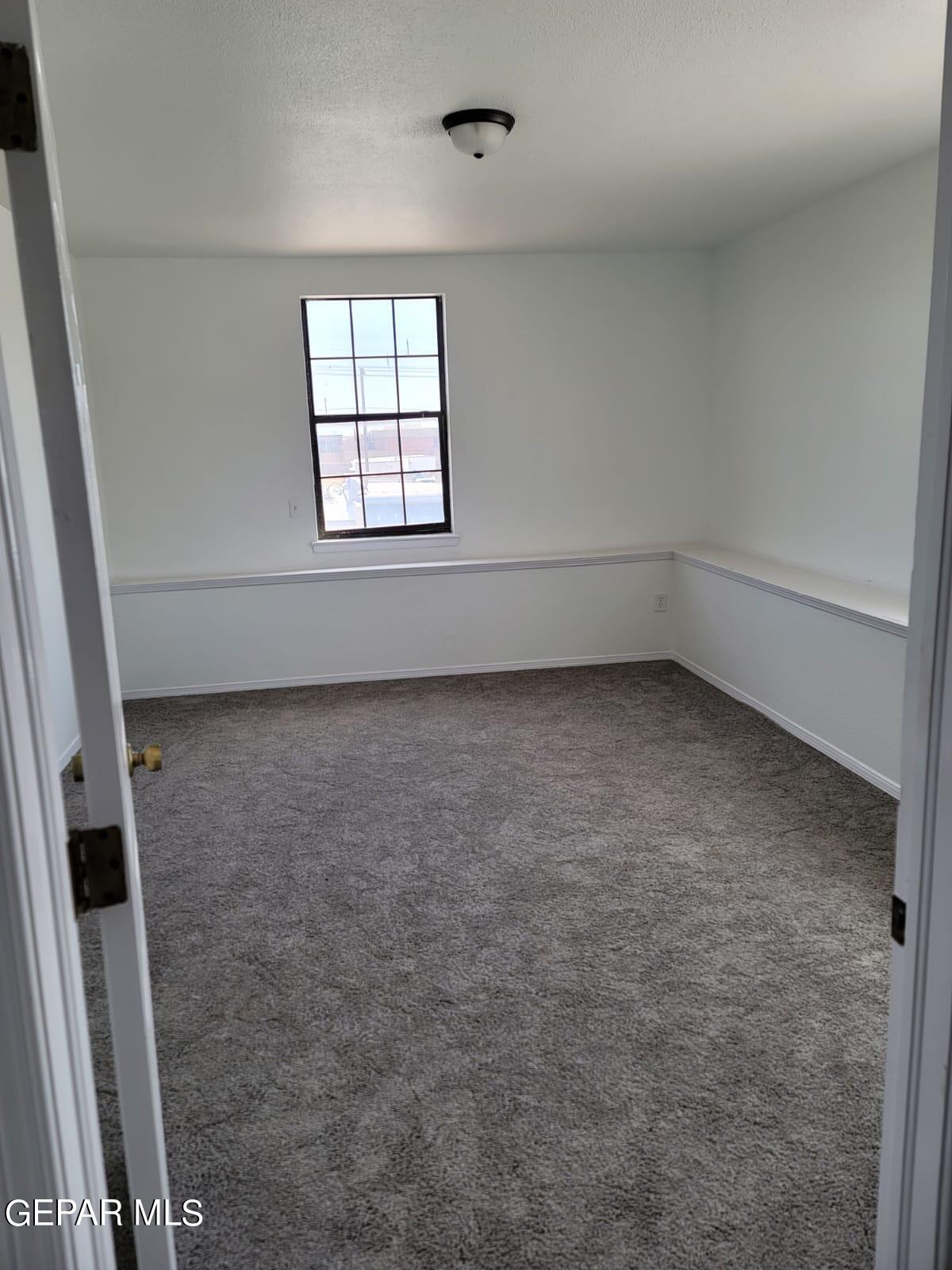 324 Valley Fair Way El Paso, TX 79907 - Photo 14 of 82 an empty room with windows