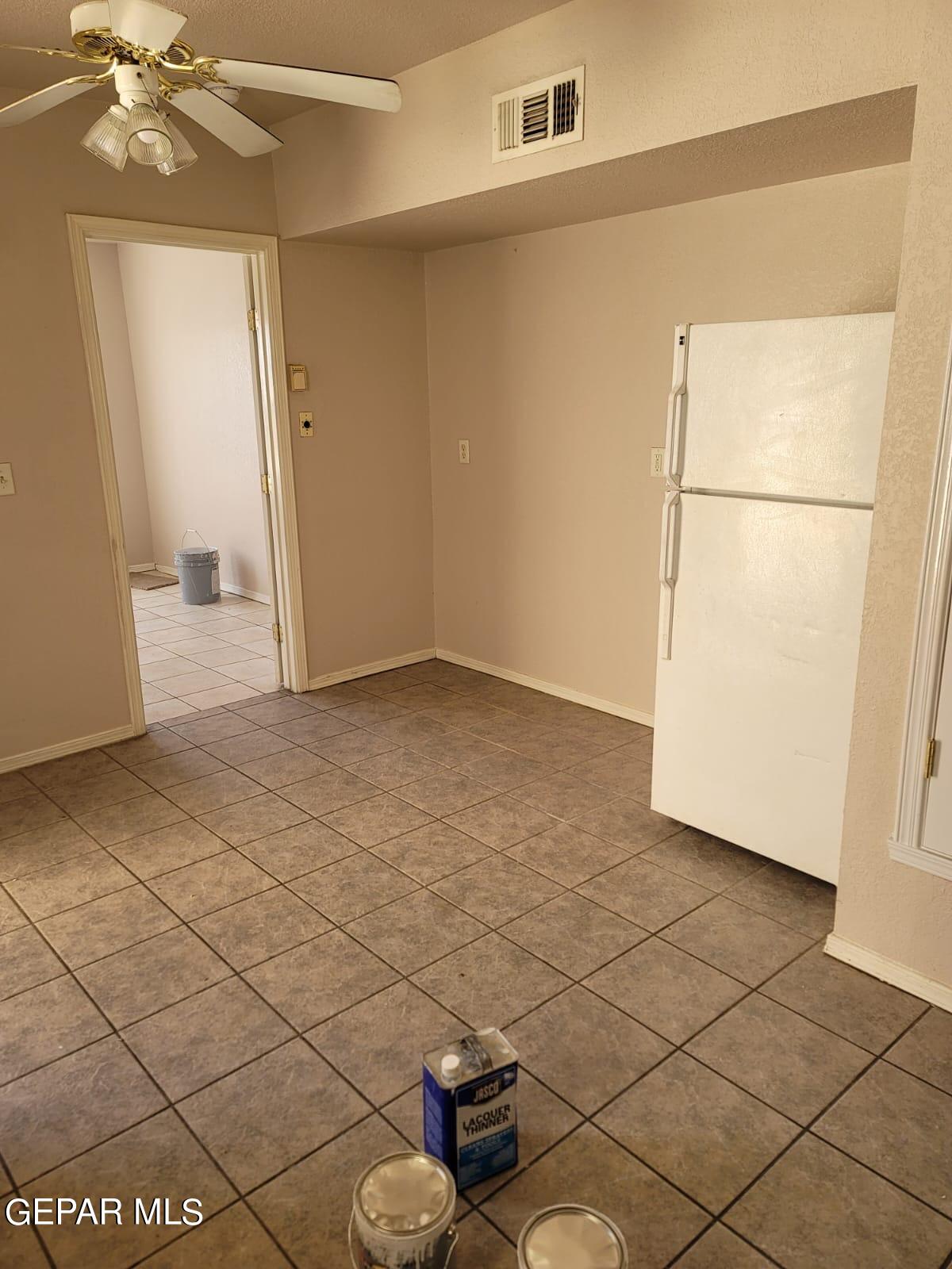 324 Valley Fair Way El Paso, TX 79907 - Photo 15 of 82 a view of a livingroom with wooden floor and a refrigerator