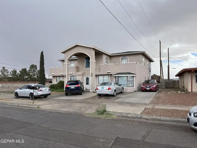 a view of a cars parked in front of a house