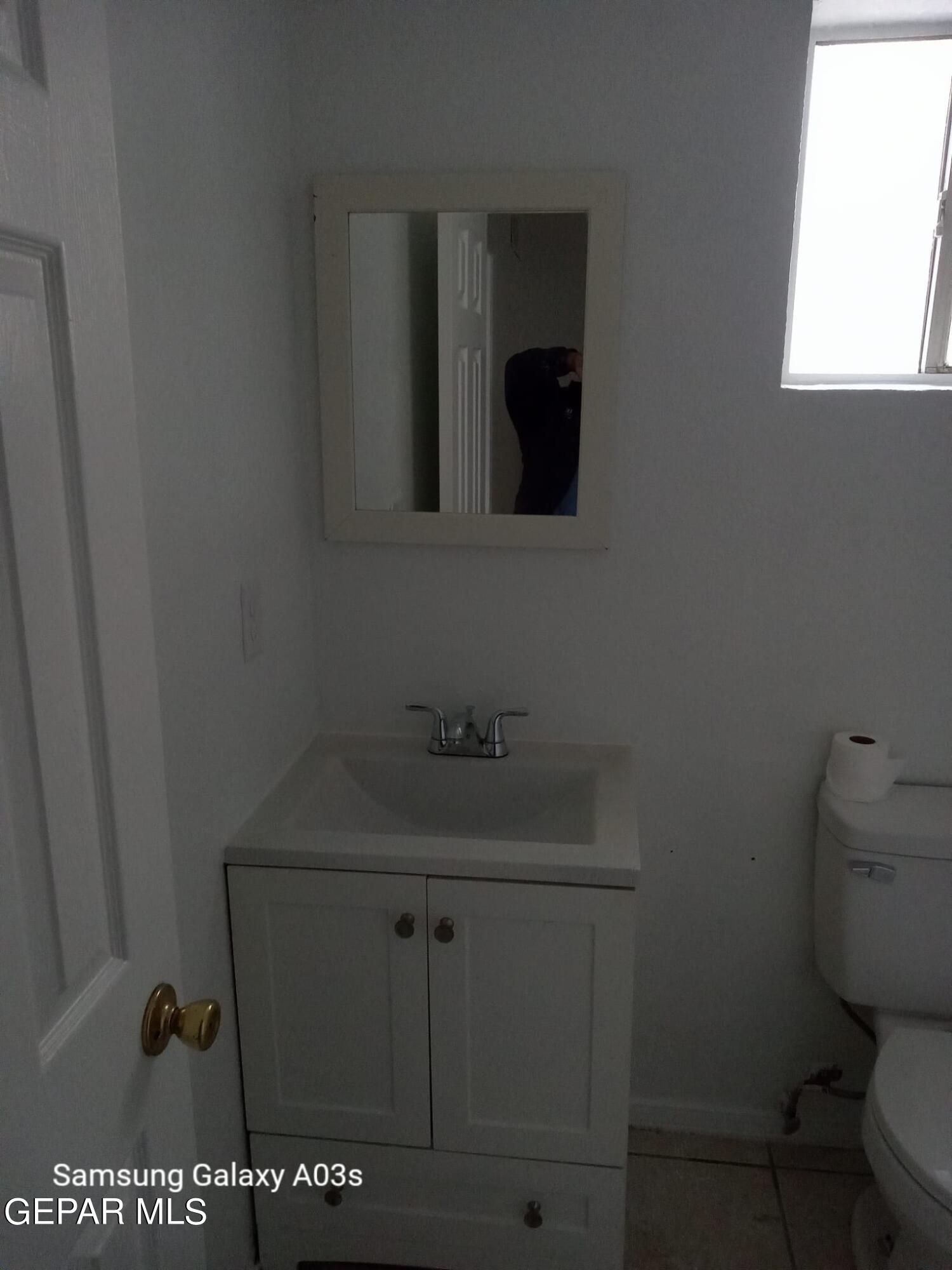 324 Valley Fair Way El Paso, TX 79907 - Photo 21 of 82 a bathroom with a sink and a toilet