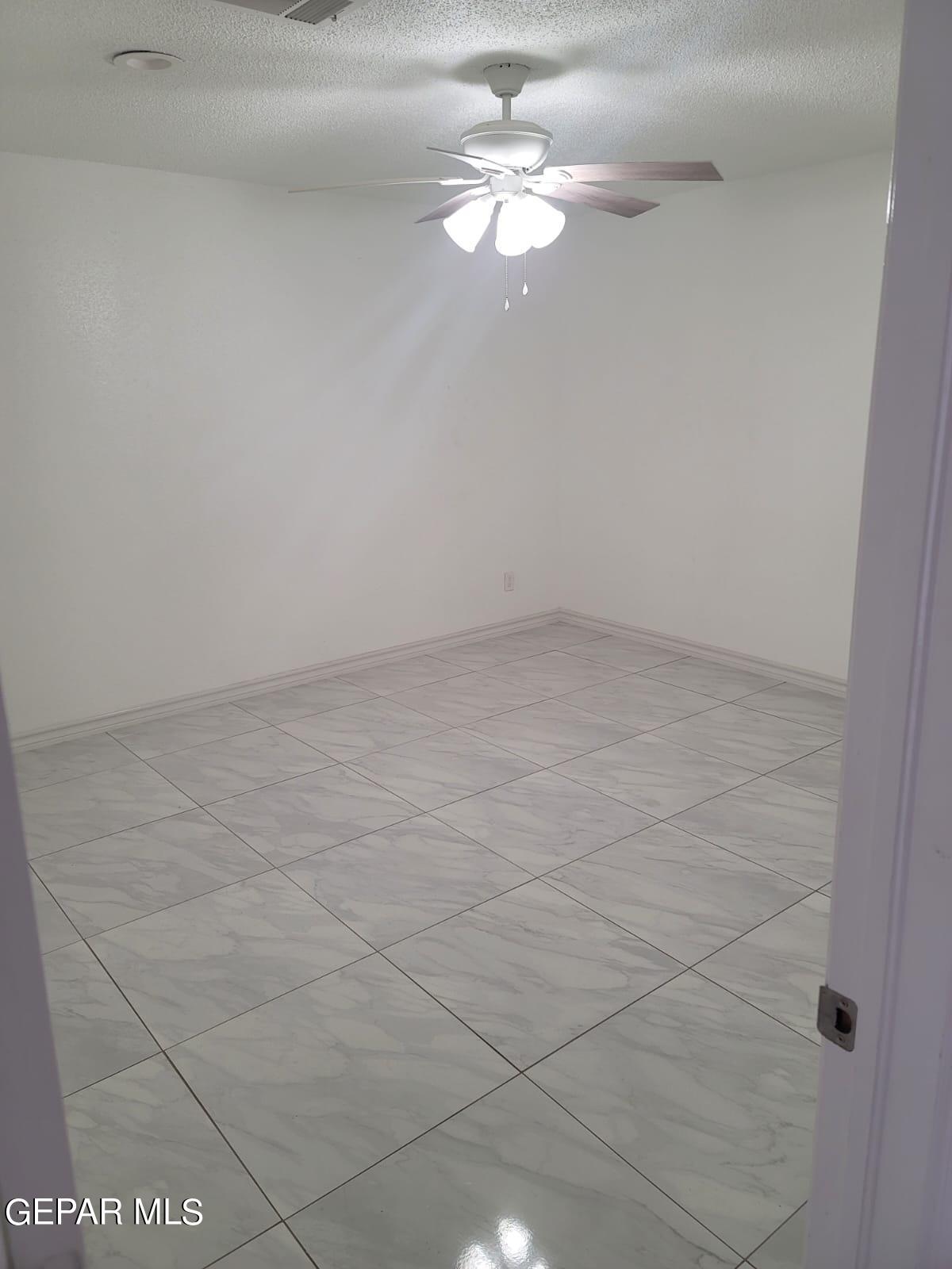 324 Valley Fair Way El Paso, TX 79907 - Photo 23 of 82 a view of a small space with wooden floor and a chandelier fan