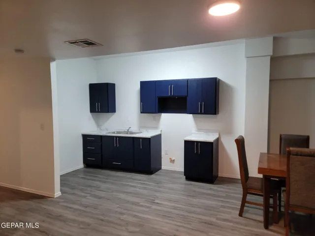 a view of a livingroom with furniture and wooden floor