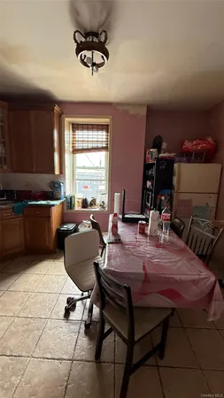 a bedroom with bed and window