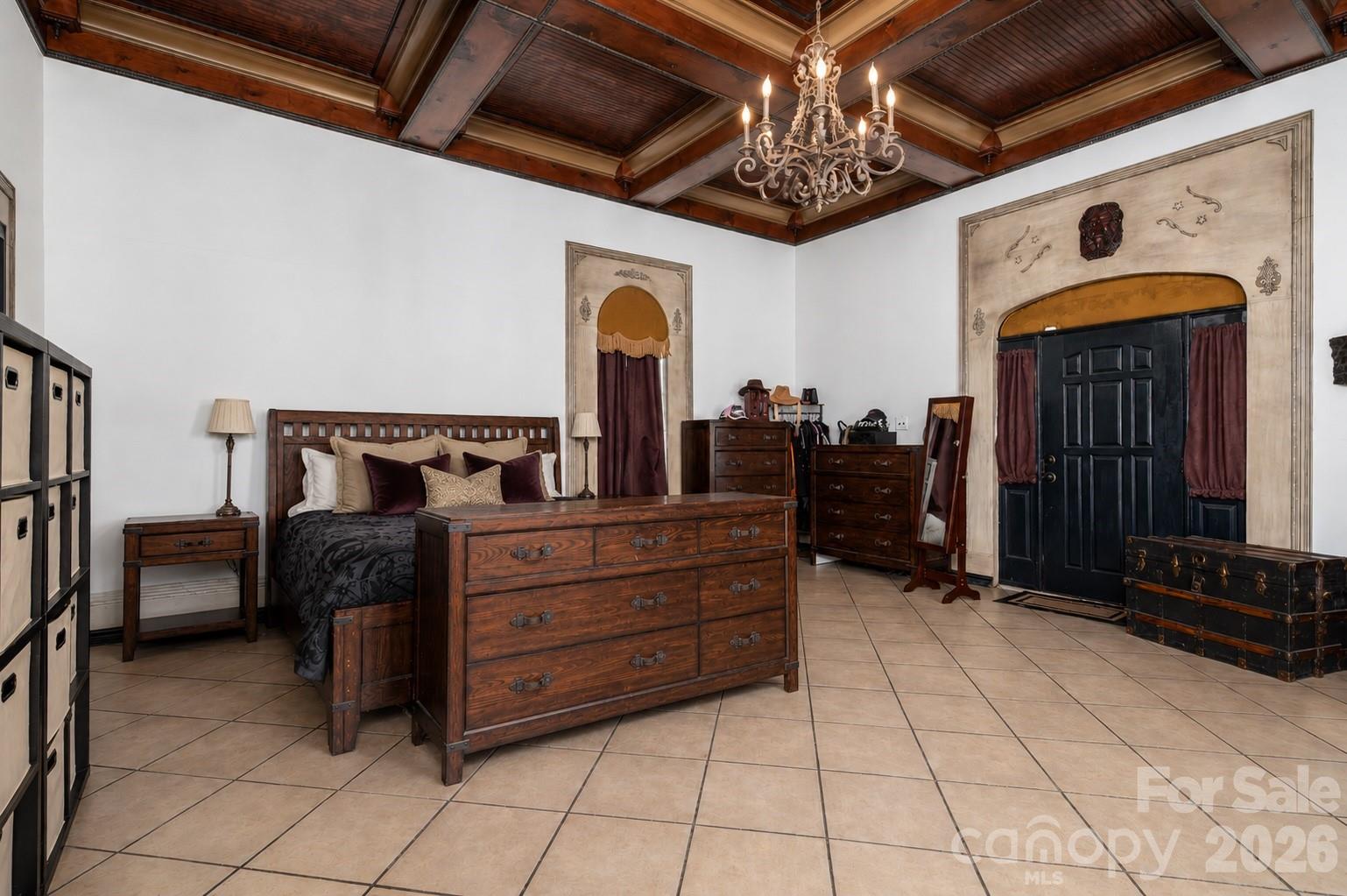 1387 George Brown Road Crouse, NC 28033 - Photo 12 of 48 a bed room with a bed and a chandelier