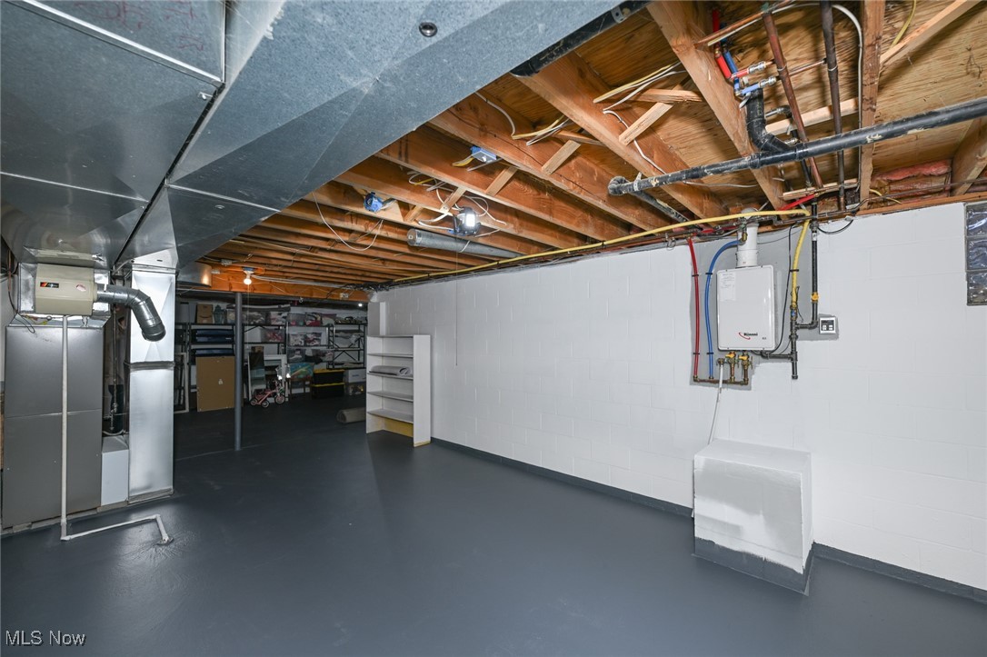 118 Lethbridge Circle Akron, OH 44321 - Photo 40 of 43 Basement featuring tankless water heater