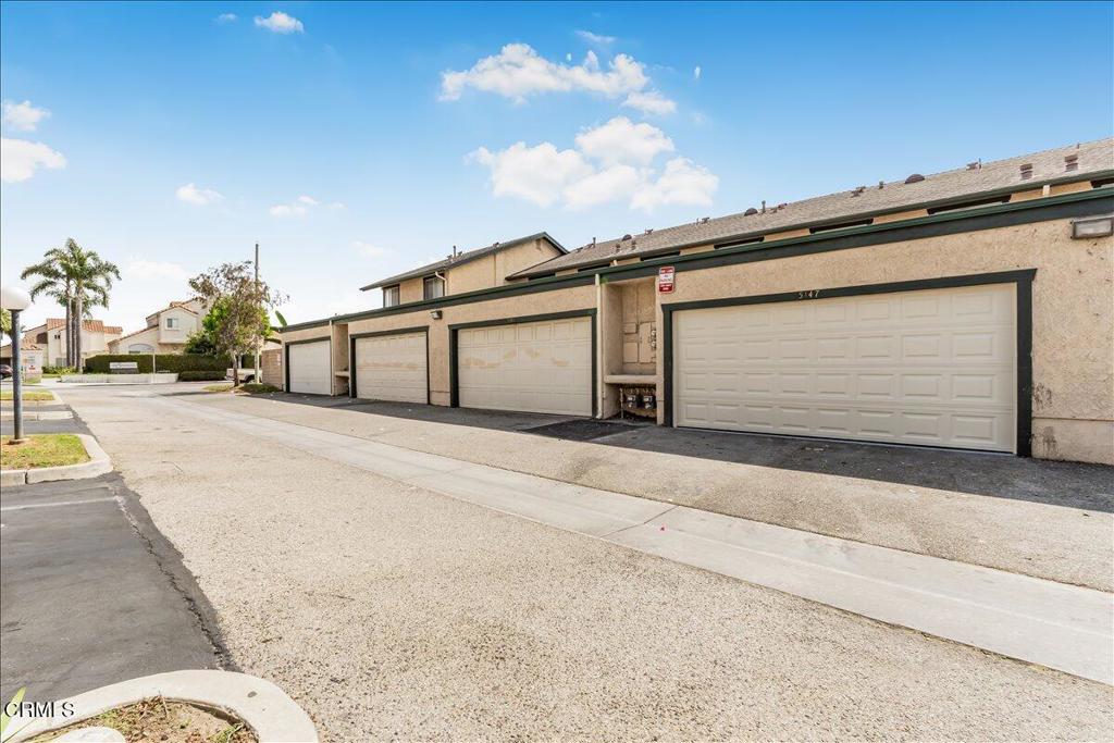 5147 Perkins Road Oxnard, CA 93033 - Photo 38 of 42 a front view of a house with a yard and garage