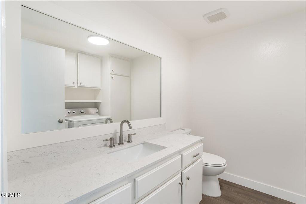 5147 Perkins Road Oxnard, CA 93033 - Photo 9 of 42 a bathroom with a sink a toilet and a mirror