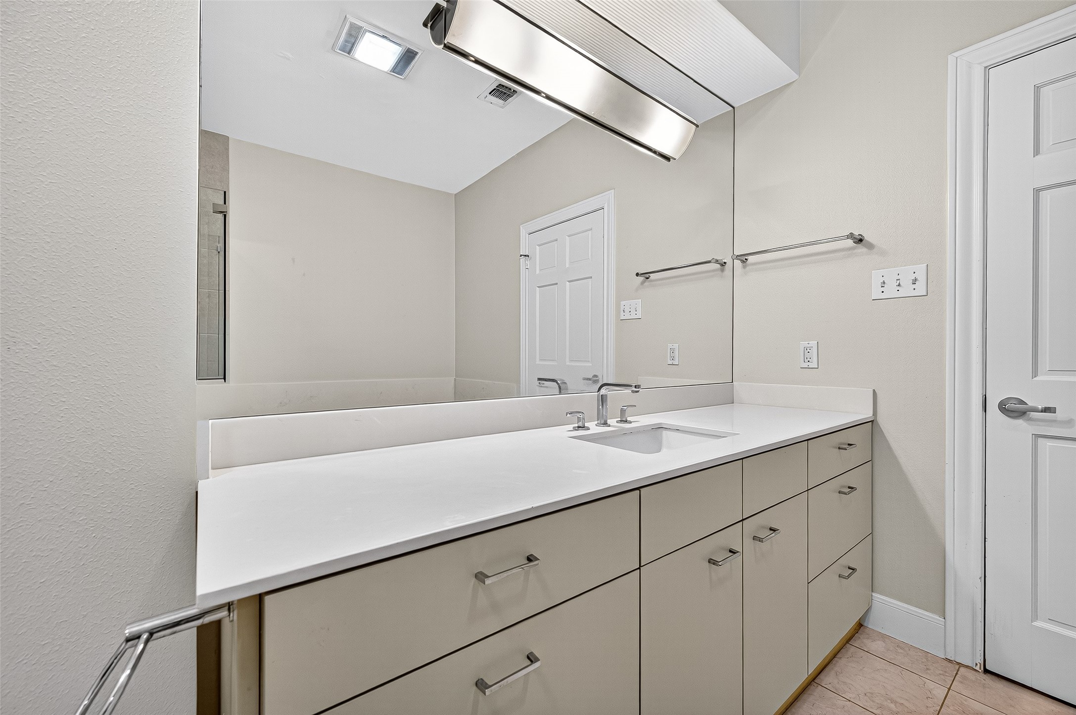 3027 Bissonnet Street Houston, TX 77005 - Photo 43 of 47 Primary bath alternate vanity view — bright, functional, and well-finished