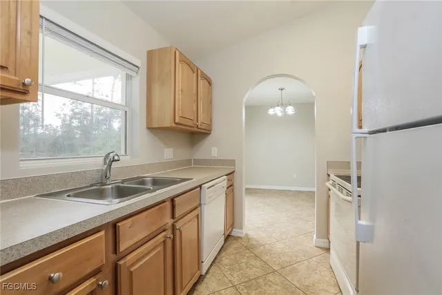 a kitchen with a stove and a sink