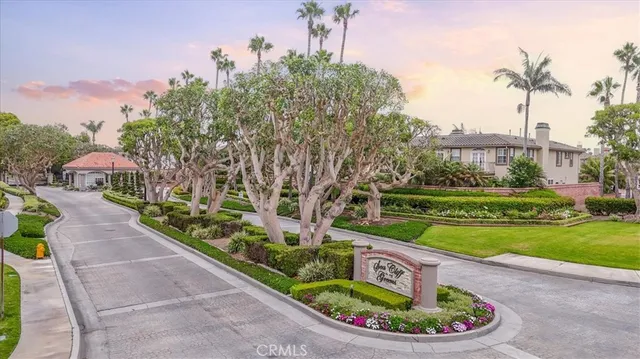 an aerial view of a house with a yard and garden