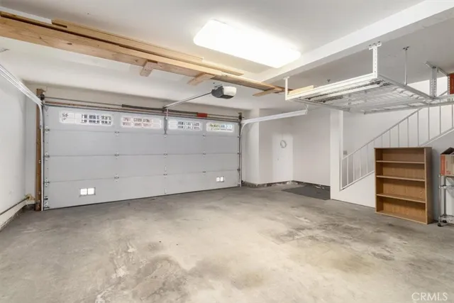 a view of a garden with a house in the background