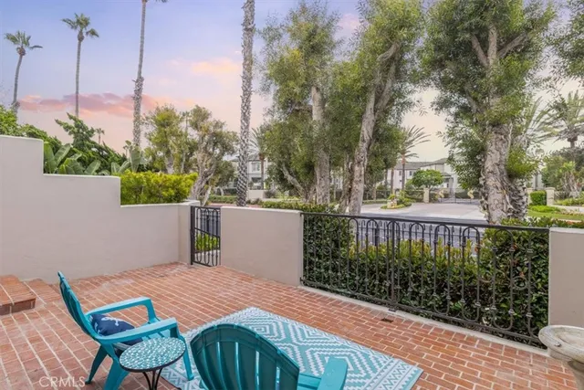 a front view of a house with outdoor seating