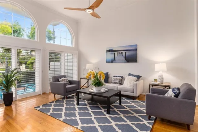 a living room with furniture and a rug