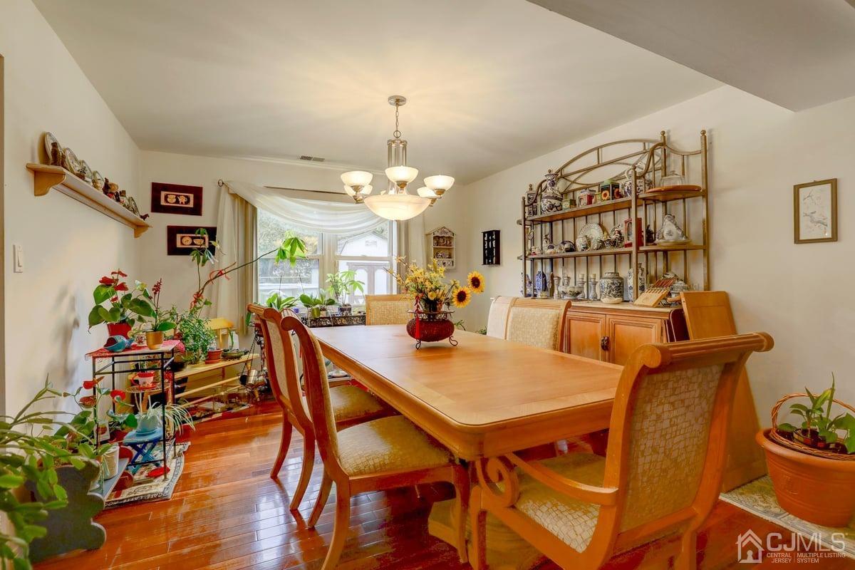 19 North Rhoda Street Monroe Township, NJ 08831 - Photo 11 of 26 a view of a dining room with furniture and wooden floor