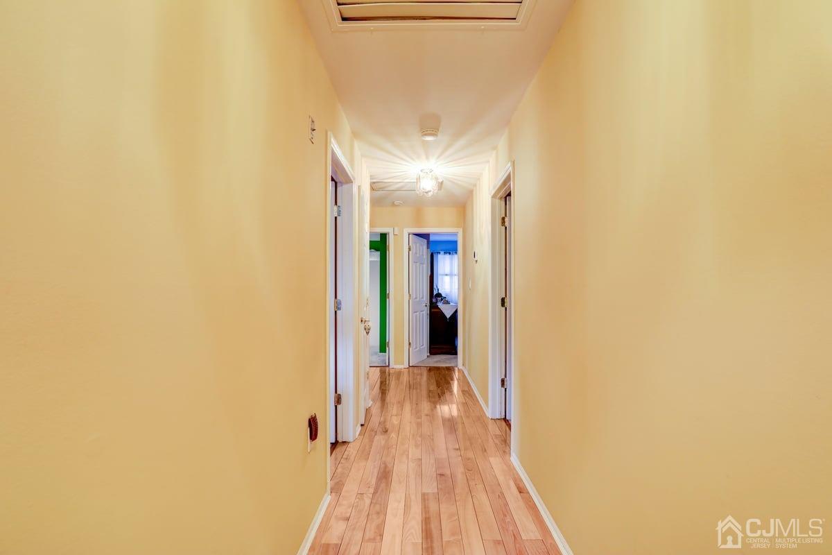 19 North Rhoda Street Monroe Township, NJ 08831 - Photo 13 of 26 a view of a hallway with wooden floor