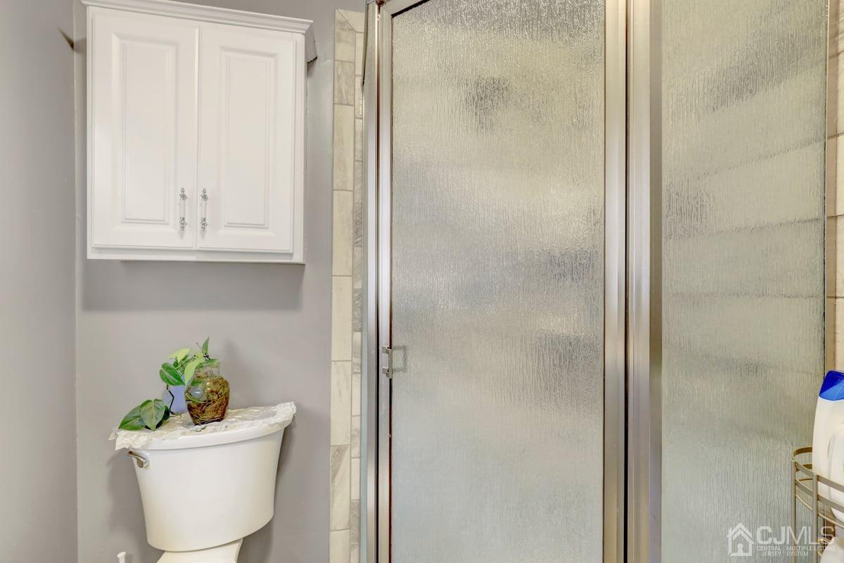 19 North Rhoda Street Monroe Township, NJ 08831 - Photo 16 of 26 a bathroom with a sink and mirror