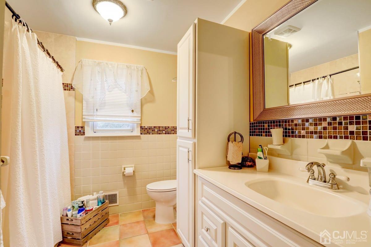 19 North Rhoda Street Monroe Township, NJ 08831 - Photo 19 of 26 a bathroom with a sink vanity granite and toilet