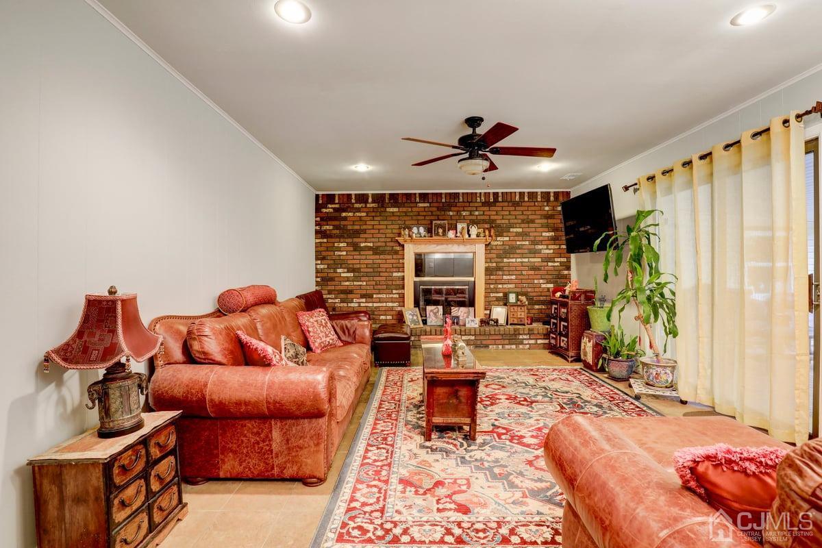 19 North Rhoda Street Monroe Township, NJ 08831 - Photo 9 of 26 a living room with furniture and a large window