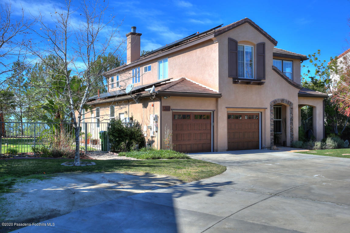 7461 Chanteclair Court Tujunga, CA 91042 - Photo 2 of 44 a front view of a house with yard