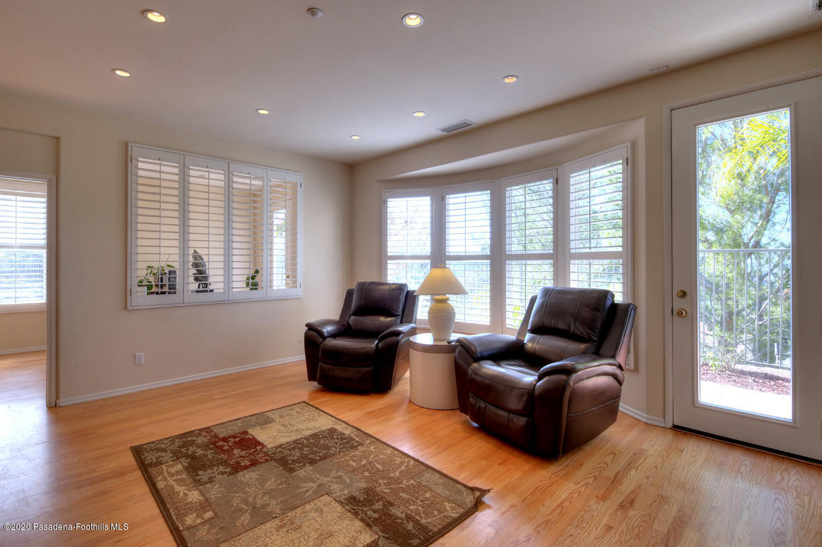 7461 Chanteclair Court Tujunga, CA 91042 - Photo 13 of 44 a living room with furniture rug and a window